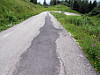 Monte Zoncolan - Ostrampe oben geflickter Asphalt